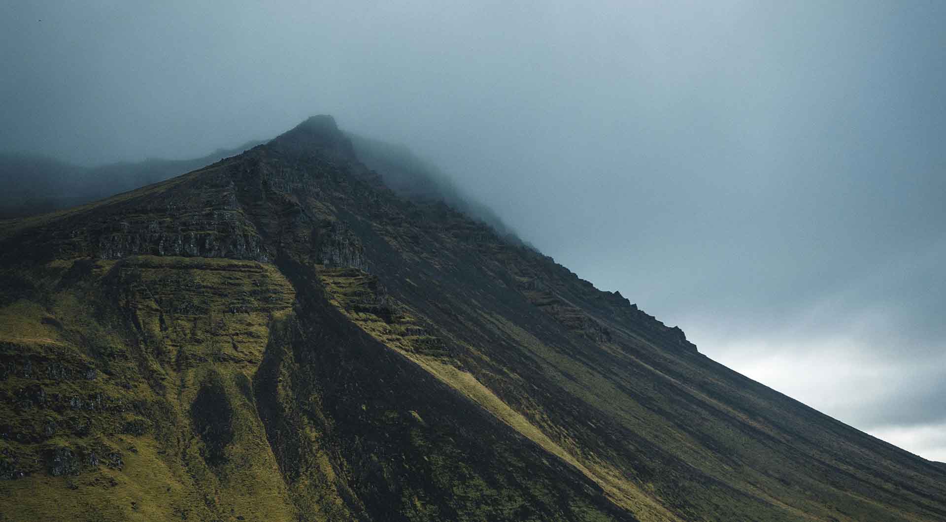 A mountain ridge emerging into cloud